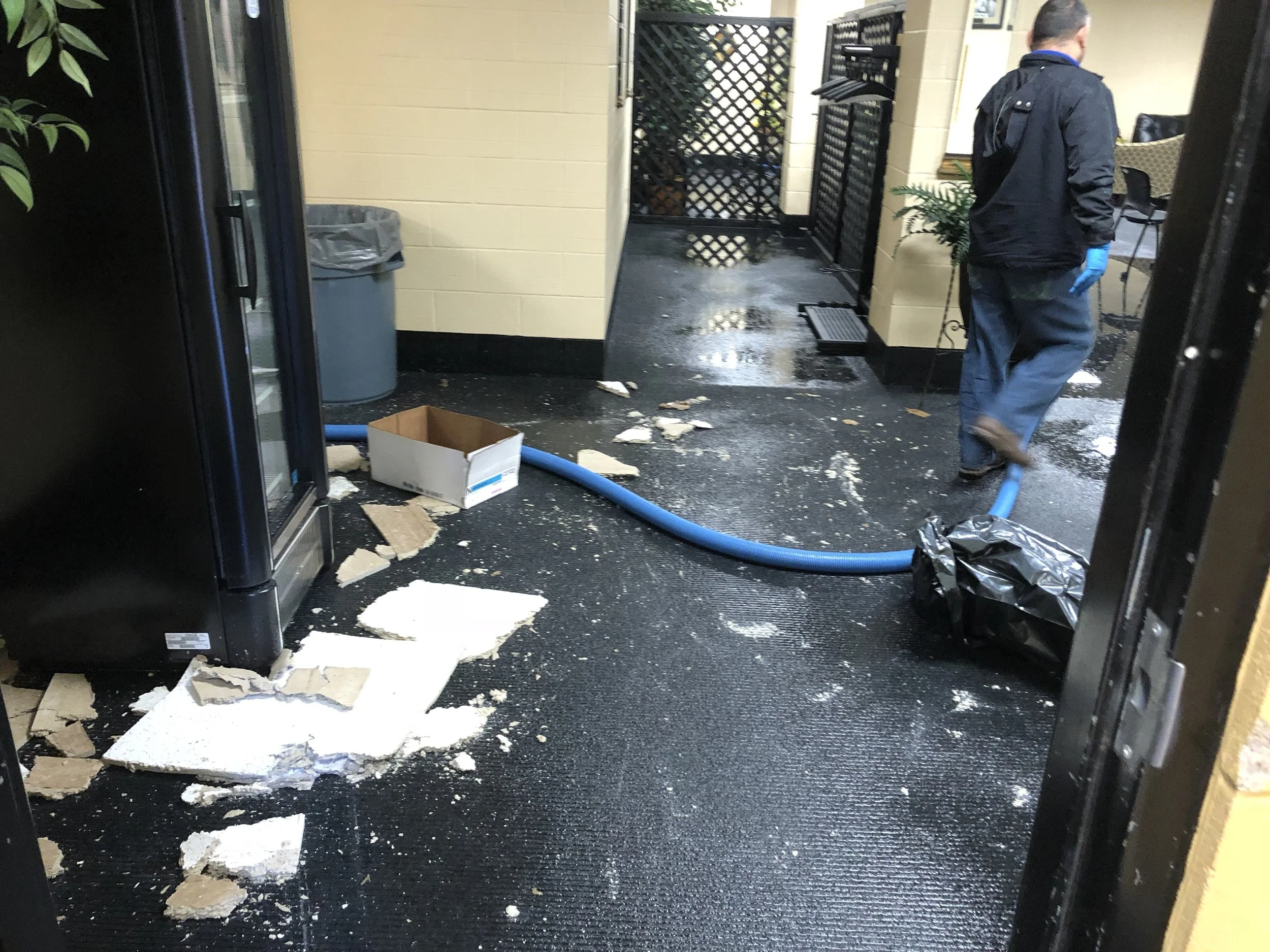 Water extraction and debris removal inside an auditorium support area